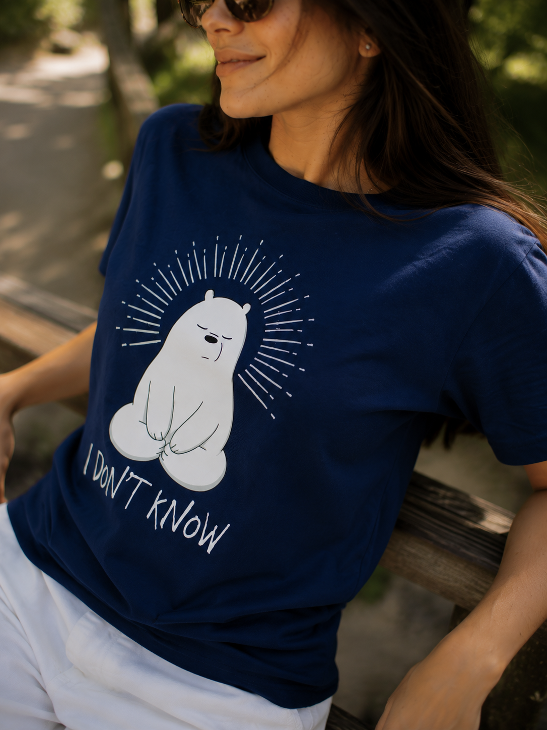 Close-up of the I don't know polar bear graphic on navy t-shirt